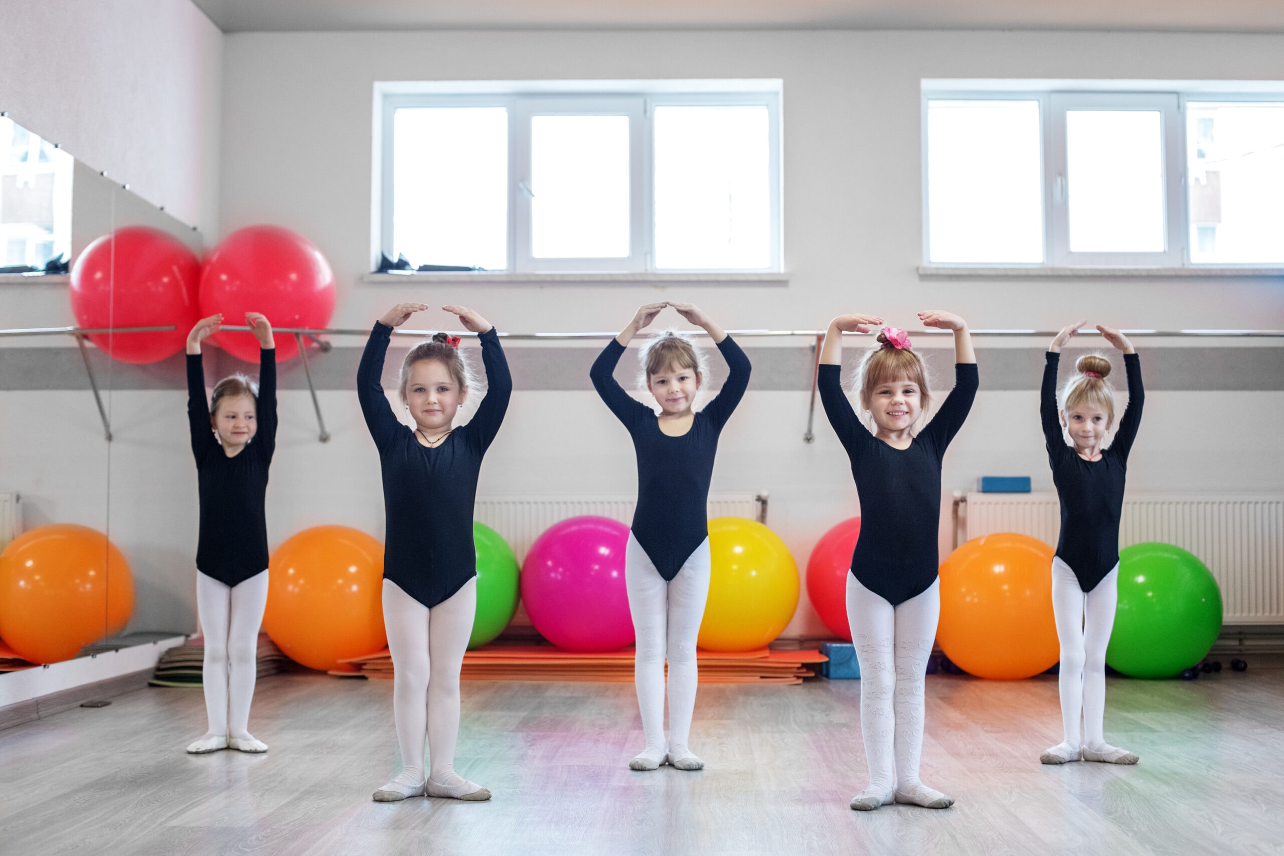 Little kids dance in dance class. The concept of sport, education, childhood, hobbies and dance